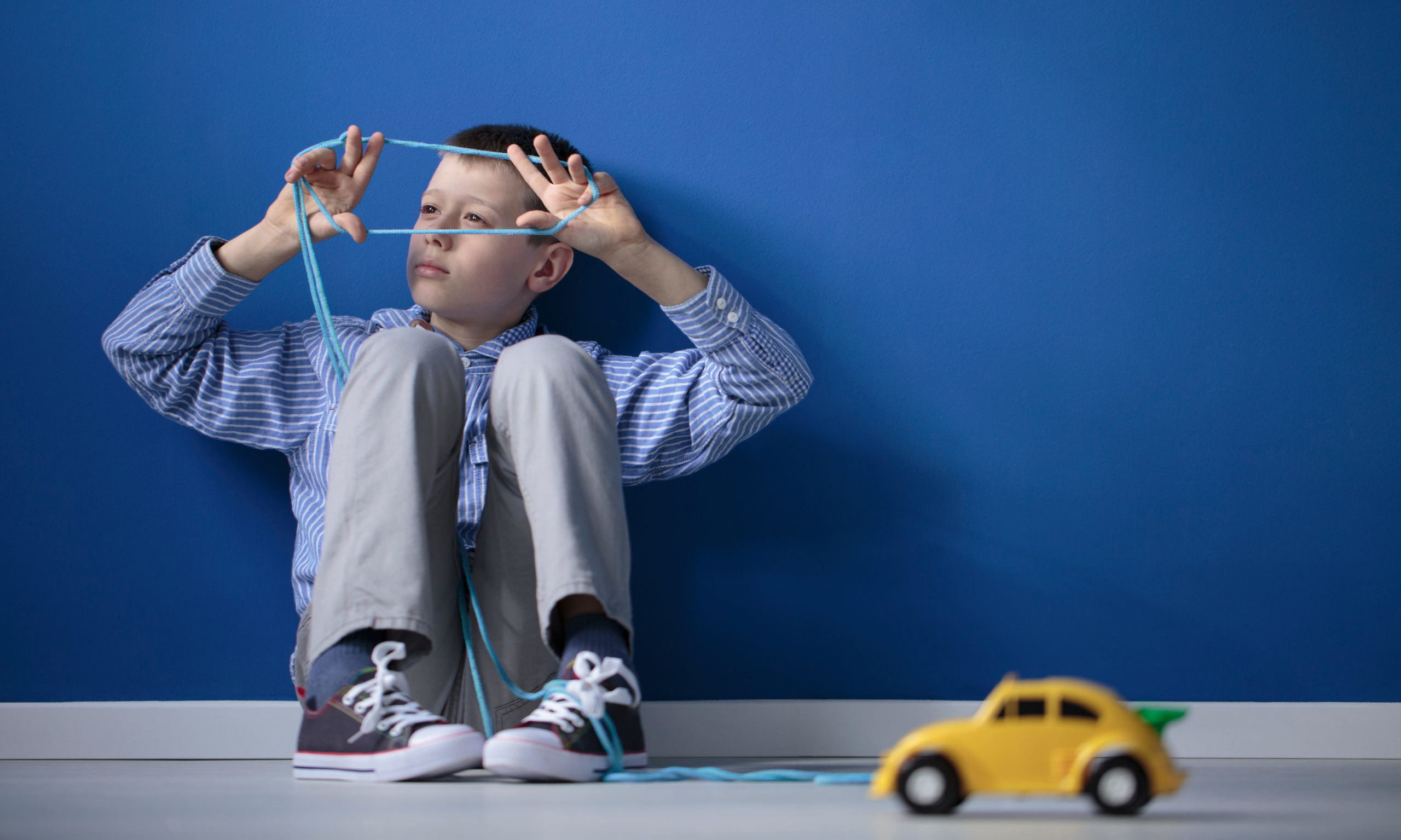 Autistic child playing blue gum