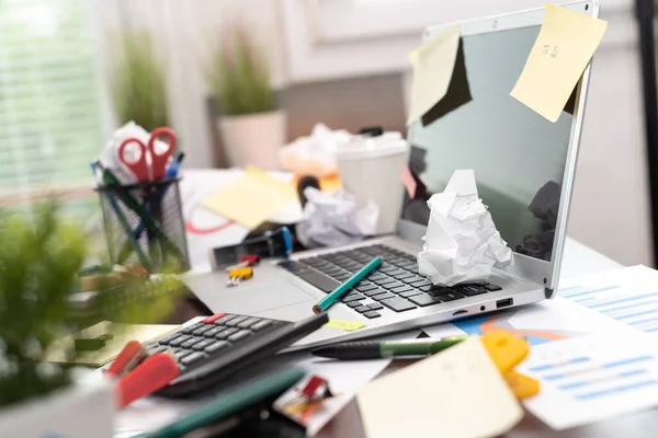 depositphotos_506313764-stock-photo-messy-cluttered-office-desk