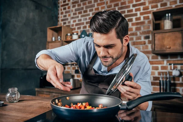 depositphotos_162010172-stock-photo-young-man-cooking